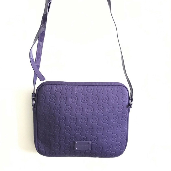 Michael Kors Handbags - MICHAEL KORS Purple Embossed All Over Logo Crossbo